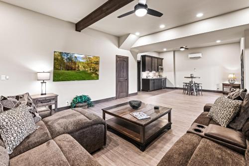 a living room with couches and a table at Peaceful Vista in Sevierville
