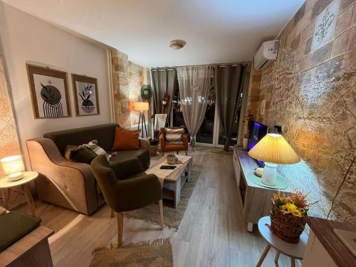 a living room with a couch and a table at Apartman A 24 in Belgrade