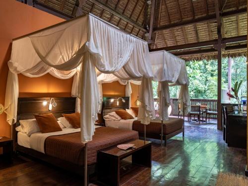 Postel nebo postele na pokoji v ubytování Refugio Amazonas Lodge