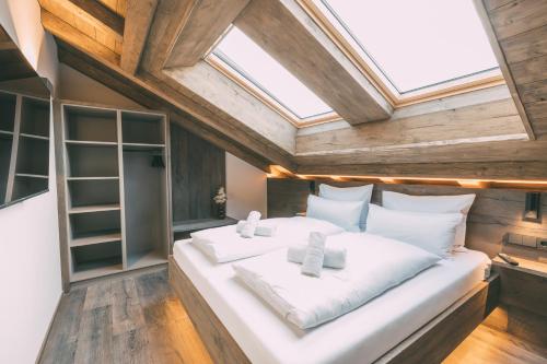 Ένα ή περισσότερα κρεβάτια σε δωμάτιο στο LIVALPIN Residence