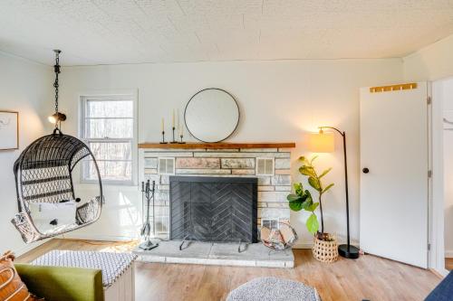 a living room with a fireplace and a mirror at Mtn Views and On-Site Hiking Trails Catskills Cabin in Round Top
