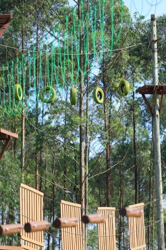 a group of chairs sitting in front of a swing at Theron Leisure Park & Residences in Kalungu