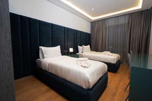 Postel nebo postele na pokoji v ubytování Amelia Appart-Hotel
