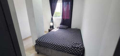 Ένα ή περισσότερα κρεβάτια σε δωμάτιο στο Apartahotel hm caribe