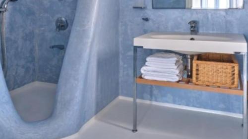 a bathroom with a sink and a shower and a sink at Premium Villa Agia Anna Mykonos in Platis Yialos Mykonos