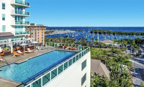 an aerial view of a hotel swimming pool with a marina at Balcony Ocean View ! Pool - WiFi - Gym - Parking in Miami