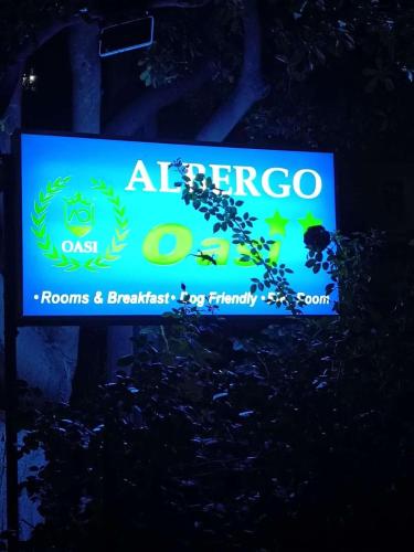 a sign for a fireoco room and breakfastessenessen at Bike Hotel Oasi in Finale Ligure