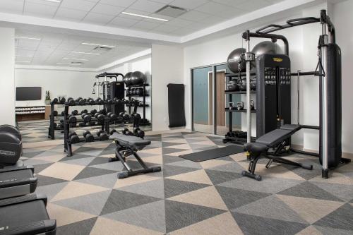 a gym with several treadmills and weights at Element Jacksonville Beach in Jacksonville Beach