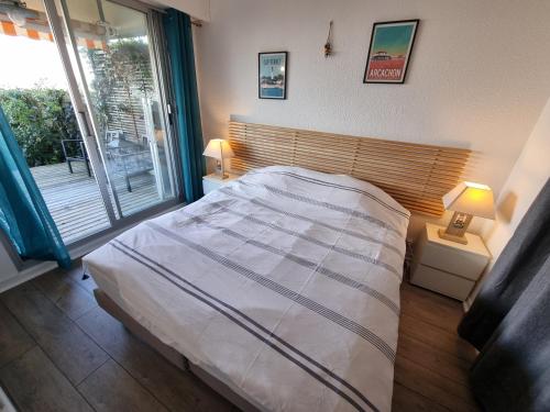 Postel nebo postele na pokoji v ubytování Face au port - Vue mer - Jardin - Wifi - Ménage - 4 pers