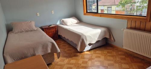 Ένα ή περισσότερα κρεβάτια σε δωμάτιο στο Hostal Nancy