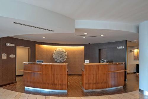 a lobby of a hospital with wooden reception desks at Fairfield Inn & Suites by Marriott New Braunfels in New Braunfels