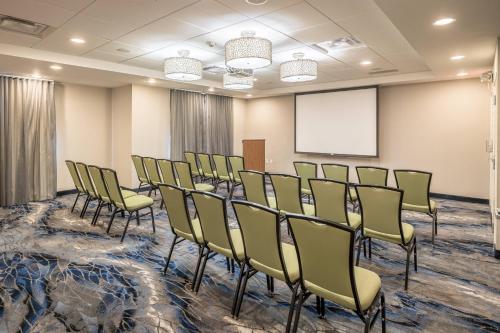 a conference room with chairs and a whiteboard at Fairfield Inn & Suites by Marriott New Braunfels in New Braunfels
