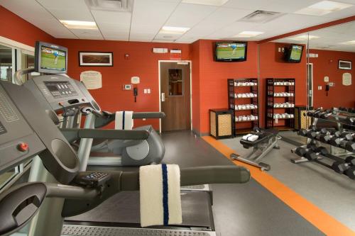 a gym with two tread machines and two televisions at Fairfield Inn & Suites by Marriott New Braunfels in New Braunfels