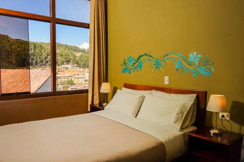 Postel nebo postele na pokoji v ubytování Wild Rover Cusco