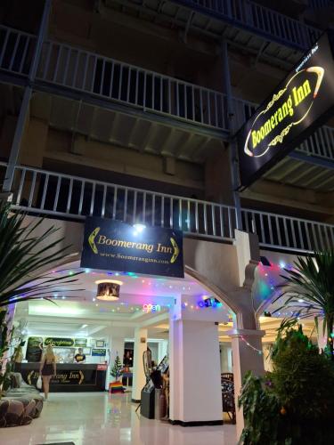 a shopping mall with a sign that reads resonance inn at Boomerang Inn in Patong Beach