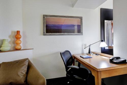 an office with a desk and a chair and a desk and a lamp at Fairfield Inn and Suites by Marriott San Antonio Boerne in Boerne