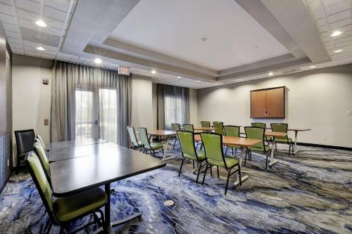 a conference room with tables and chairs and a podium at Fairfield Inn and Suites by Marriott San Antonio Boerne in Boerne