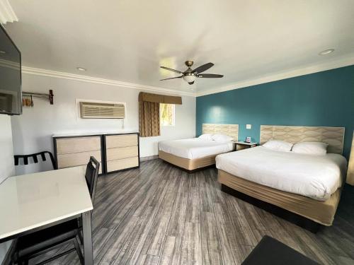 Ένα ή περισσότερα κρεβάτια σε δωμάτιο στο Viking Motel-Ventura