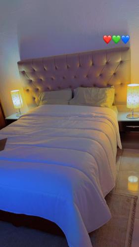 Una cama o camas en una habitación de QuissinguiLda