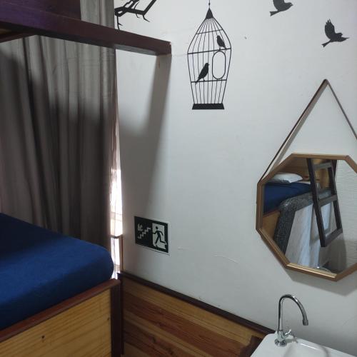 Ένα ή περισσότερα κρεβάτια σε δωμάτιο στο Hostel e Pousada Boa Vista