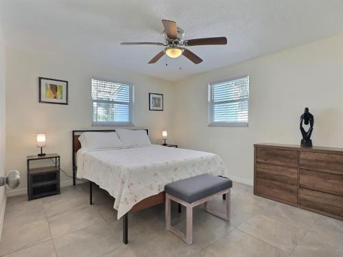 a bedroom with a bed and a ceiling fan at One Ocean - A 1101 in Sarasota