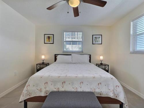 a bedroom with a bed with a ceiling fan at One Ocean - A 1101 in Sarasota