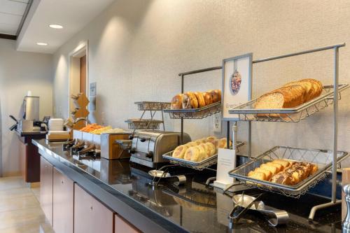 a bakery with loaves of bread on a counter at Fairfield Inn & Suites by Marriott Rockford in Rockford