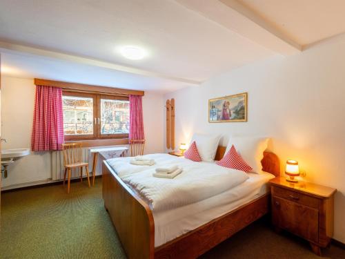Postel nebo postele na pokoji v ubytování Holiday home Ginin Ramsau in Zillertal