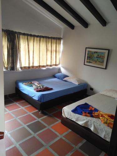 Una cama o camas en una habitación de Finca la Irlanda