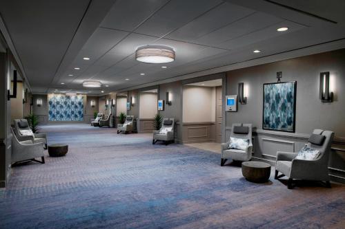a large lobby with chairs and a waiting room at Delta Hotels by Marriott Richmond Downtown in Richmond