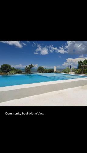 a photograph of a swimming pool with a view at Rest Studio Apartment in Dambani