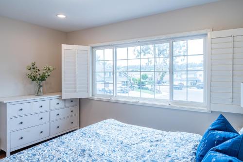 a bedroom with a bed and a window at Luxurious Villa in Diamond Bar- Private Cul-de-Sac in Diamond Bar