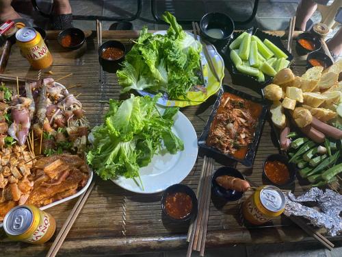 a table topped with lots of different types of food at Sapa Grand Blue Hotel in Sa Pa