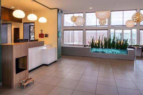 an office lobby with a large aquarium in the middle at Element Lexington in Lexington