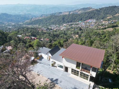 an aerial view of a house with a roof at Doichang view-Sunset room in Ban Huai Khai