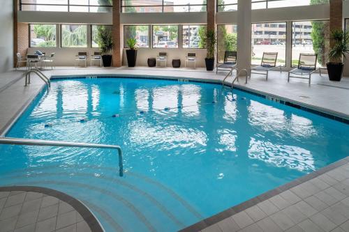 a large pool with blue water in a building at Delta Hotels by Marriott Huntington Downtown in Huntington
