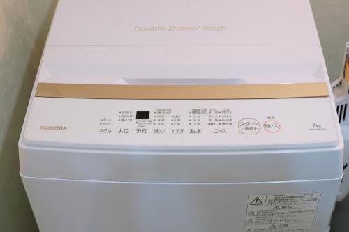 a white box sitting on top of a refrigerator at Nihonbashi Royal in Osaka