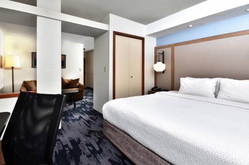 a hotel room with a bed and a desk at Fairfield Inn & Suites by Marriott Richmond Innsbrook in Richmond