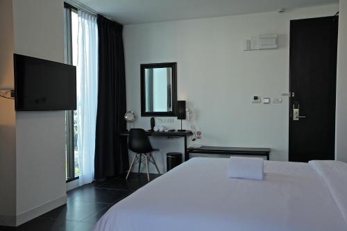 Postel nebo postele na pokoji v ubytování BED Nimman - Adults Only