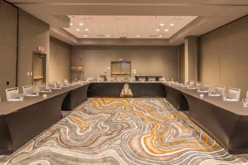 a conference room with a large carpet on the floor at Delta Hotels by Marriott Fargo in Fargo