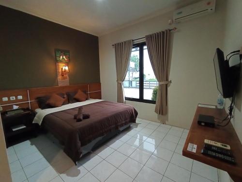 Yokima Beach Hotel 객실 침대