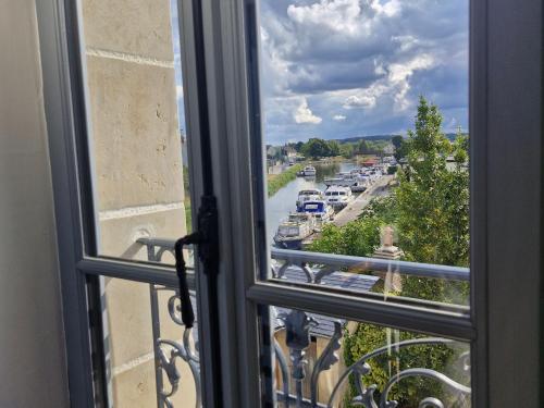 a view of a city street from a window at Grand Gîte à Briare - Animaux et Parking Privé - FR-1-590-541 in Briare