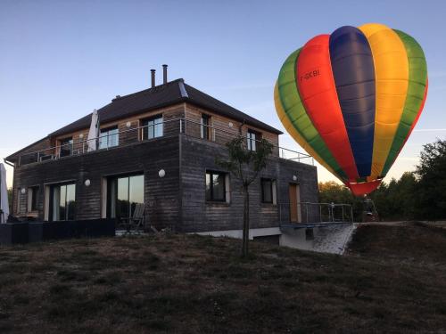 two hot air balloons in front of a house at Gîte en Sologne avec loisirs et activités proches - FR-1-590-554 in Jouy-le-Potier