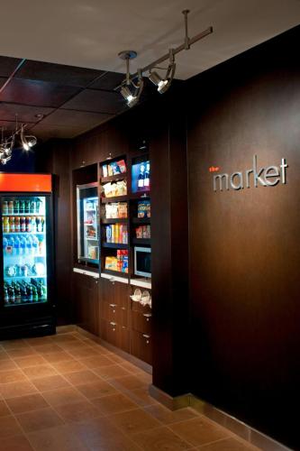 a market store with a martacist sign on the wall at Courtyard Tampa Westshore/Airport in Tampa
