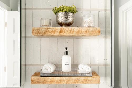 a bathroom with a shelf with a bottle of soap at Spacious Family Friendly Townhome in Central Park in Denver