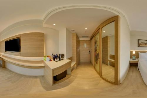 a hotel room with a bed and a desk at Fairfield by Marriott Lucknow in Lucknow