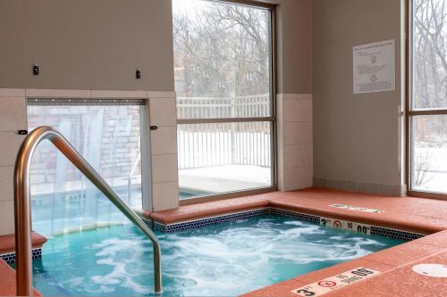 a hot tub in a room with a window at Fairfield Inn & Suites by Marriott Fair Oaks Farms in Fair Oaks