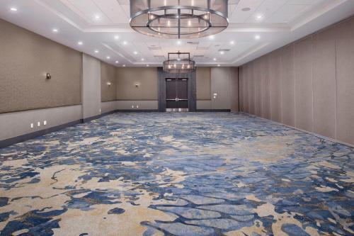 a ballroom with a large room with a large carpeted floor at Delta Hotels by Marriott Seattle Everett in Everett