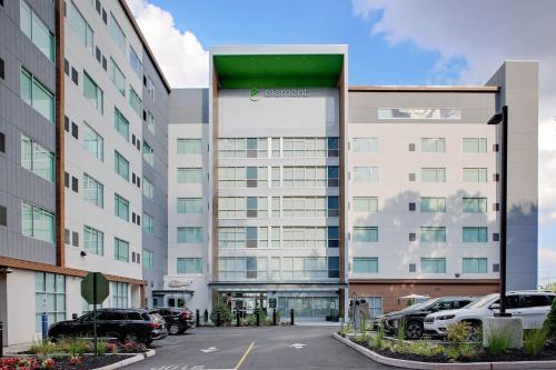 an office building with cars parked in a parking lot at Element New York Wood Ridge in Wood-Ridge