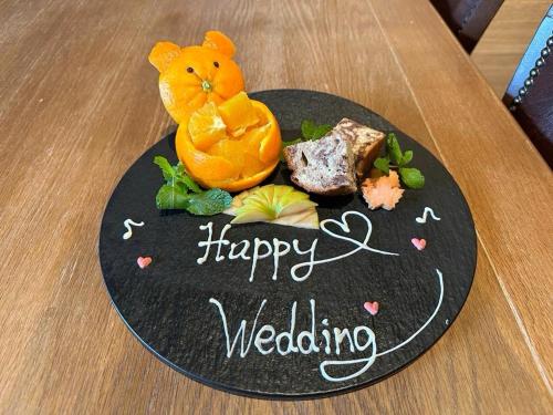 a plate of food with a teddy bear on it at Almeria Hotel in Yamanakako